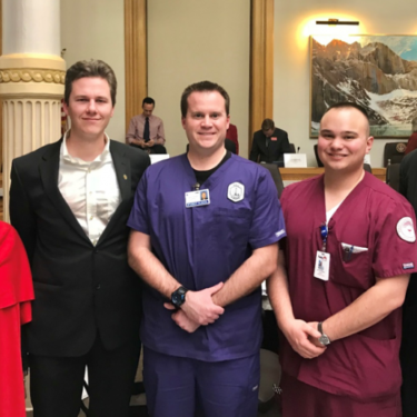 nursing students pose for photo as bill passes