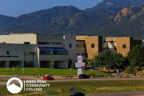 Photo of Pikes Peak Community College and mountains behind it