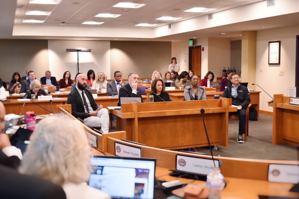 Image of panel speaking in front of the State Board for Community Colleges and Occupational Education